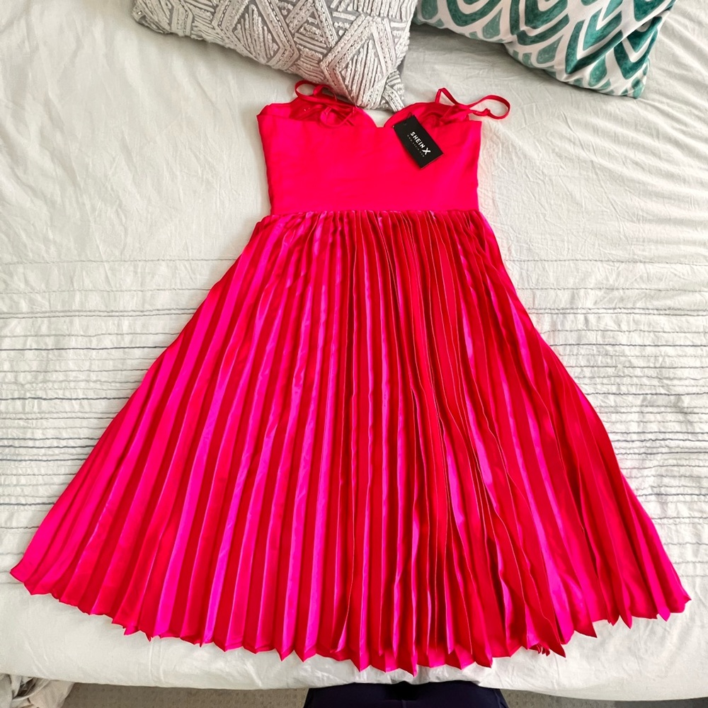 Midi length satin fuchsia dress.